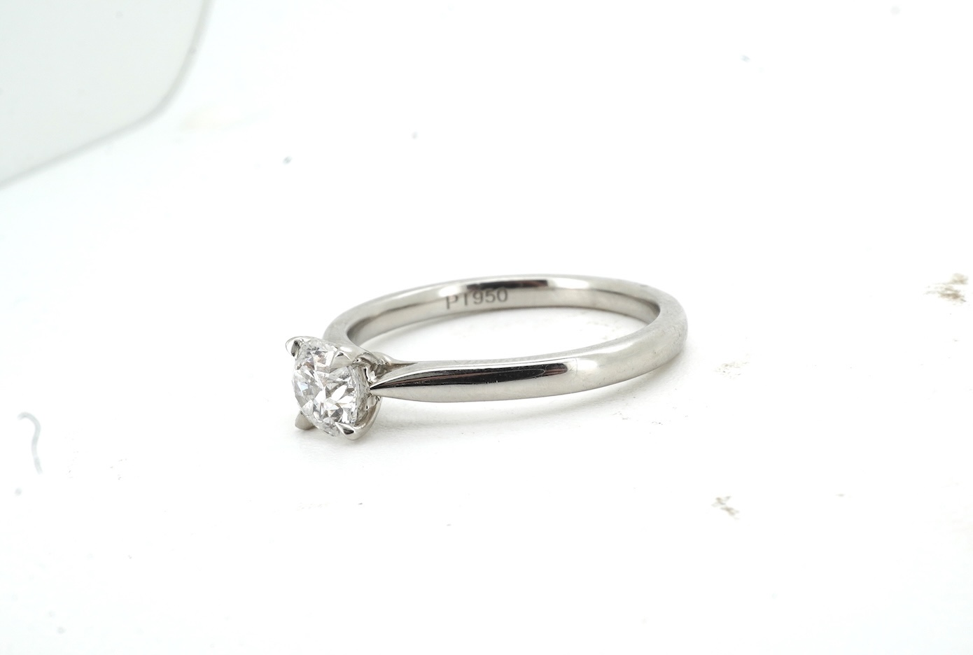 A diamond ring, claw-set with a brilliant-cut diamond weighing approximately 0.55 carats, mounted in platinum, size L1/2, British hallmarks, gross weight approximately 4 grams